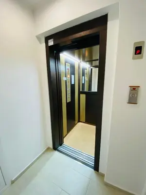 an elevator door in a building with the door open at Family Hotel The Golden fish in Sozopol