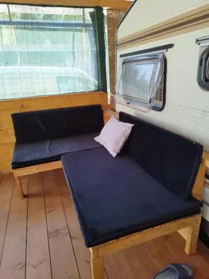 a bench sitting in the back of a trailer at каравана Марбея in Chernomorets