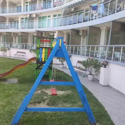 a playground in a yard next to a building at Silver A28 in Byala