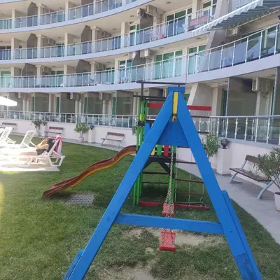 a playground in the courtyard of a hotel at Silver A28 in Byala