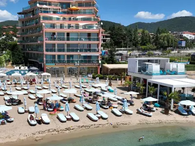 an aerial view of a beach with boats and umbrellas at Beachfront Smart Homes by Marty's in Sunny Beach