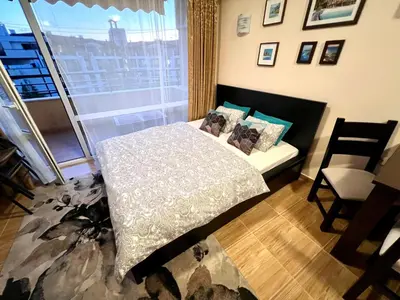 a bedroom with a bed and a window at Paradise Dreams apartment in Sveti Vlas
