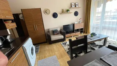 a living room with a kitchen and a dining room at Paradise Dreams apartment in Sveti Vlas