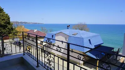 a view of a house from a balcony at Апартаменти Атеа на плажа - Apartments Atea on the beach in Obzor
