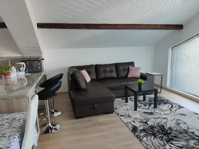 a living room with a couch and a table at Apartment 7 in Tsarevo