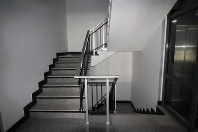 a staircase in an empty building with a railing at PARADISO 'В' 106 Private Cozy Studio NESSEBAR in Nesebar