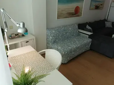 a living room with a couch and a chair at Silver A 27 in Byala