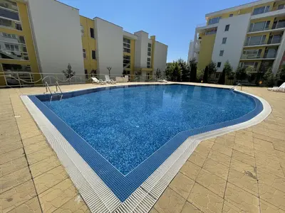 a swimming pool in the middle of a building at Fort Noks - Menada Apartments in Sveti Vlas