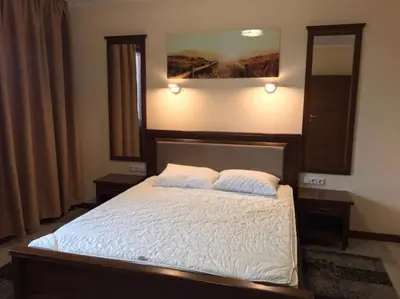 a bedroom with a bed with a large mirror at Casa Real B 5-1 in Sveti Vlas