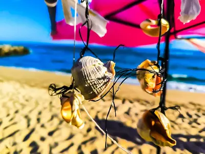 a close up of a beach with an umbrella at William's apartments - third special studio in Sveti Vlas