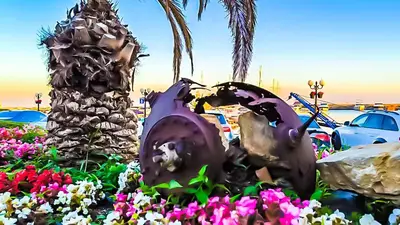 a statue of a palm tree and flowers at William's apartments - third special studio in Sveti Vlas