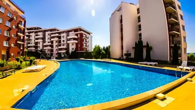 a large swimming pool in front of some buildings at William's apartments - third special studio in Sveti Vlas