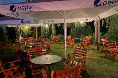 a group of tables and chairs under a tent at Apartment Doris in Sunny Beach