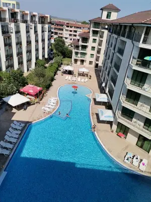 an aerial view of a swimming pool next to some buildings at Pool Apartment Amadeus Lux in Sunny Beach