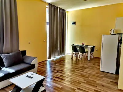 a living room with a couch and a table at Pool Apartment Amadeus Lux in Sunny Beach