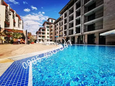 a large swimming pool in front of a building at Pool Apartment Amadeus Lux in Sunny Beach
