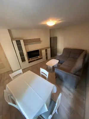 a living room with a table and a couch at VINTAGE Top Centre in Burgas City