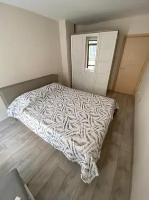 a bedroom with a bed with a zebra print blanket at VINTAGE Top Centre in Burgas City