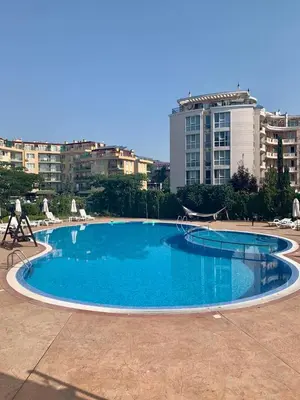 a large blue pool with a playground in a city at AFRODITA I 112 Private Cozy Studio Sunny Beach in Sunny Beach