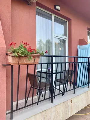 a balcony with a table and chairs and a window at AFRODITA I 112 Private Cozy Studio Sunny Beach in Sunny Beach