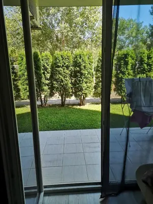 a view of a yard from a window at Studio VIP-ZONE in Sunny Beach