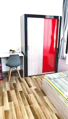 a room with a desk and a chair and a sliding door at Family Apartments Amadeus lux in Sunny Beach