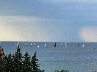 a group of sailboats on a large body of water at Апартамент Свети Влас in Sveti Vlas