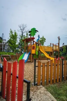 a playground with a slide in a park at Sunrise - Apartment 41,Santa Marina, Sozopol in Sozopol