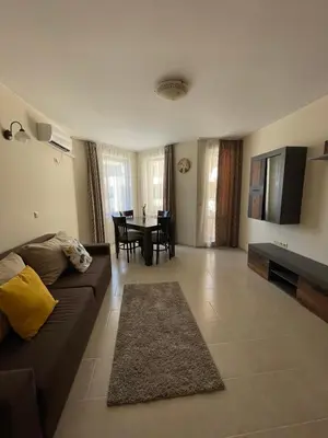 a living room with a couch and a table at Rich-2 SP apartments in Ravda