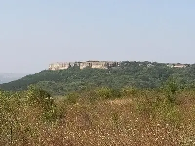 a view of a hill with a mountain in the background at SRB Sadovo-Resort-Bulgaria in Sadovo