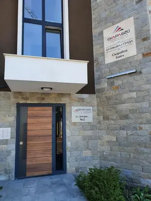 a entrance to a building with a wooden door at Sarafovo Sea Star in Burgas City