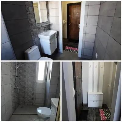 a bathroom with a sink and a toilet and a shower at A-19 Sea View Studio-Apartmen Sarafovo in Burgas City