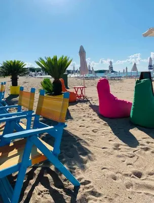 a group of chairs on a sandy beach at A-19 Sea View Studio-Apartmen Sarafovo in Burgas City