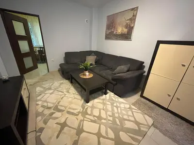 a living room with a couch and a table at Apartment Lazur Karlovo 8 street free parking in Burgas City