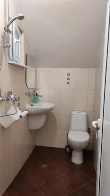 a bathroom with a toilet and a sink at Apartment Lazur Karlovo 8 street free parking in Burgas City