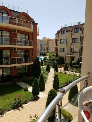 a view of a courtyard of a apartment building at Ravda Sun Sea Ressort 2 in Ravda