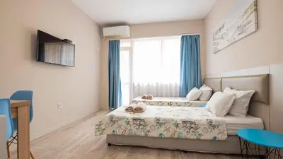 a small bedroom with a bed and a window at Студио Булаир 1 с безплатен паркинг in Burgas City