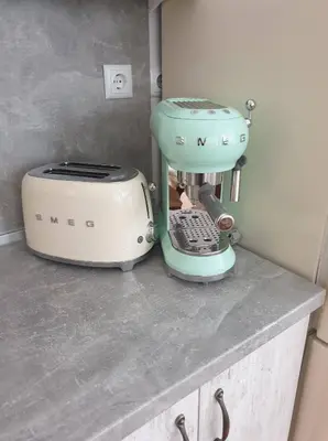a mixer and a toaster on a kitchen counter at Апартамент BOHO CHIC 2 Free parking in Varna City
