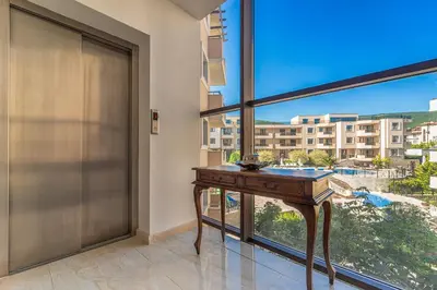 a desk in a room with a large window at Premium complex Millennium 2 - Family apartment & Spa in Sveti Vlas