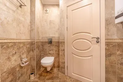 a bathroom with a toilet and a glass door at Premium complex Millennium 2 - Family apartment & Spa in Sveti Vlas
