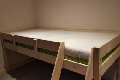 a wooden bunk bed in a small room at The Penthouse in Varna City