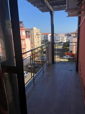 a balcony with a view of a city at Dunav Apt.4 in Ravda