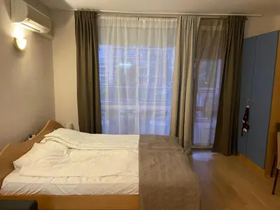 a bedroom with a bed in front of a window at studio, sunny fort, sunny beach in Sunny Beach