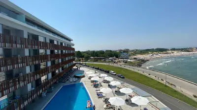 a view of a hotel with a swimming pool and a beach at PARADISO 'В' 107 Private Cozy Studio NESSEBAR in Nesebar