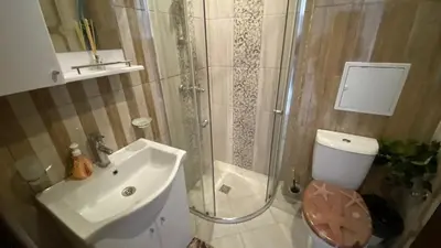 a bathroom with a shower and a toilet and a sink at PARADISO 'B' 108 Private Cozy Room NESSEBAR in Nesebar