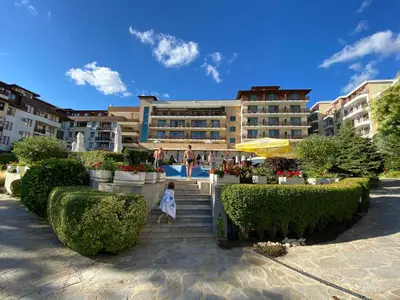 a girl is walking down the stairs in a resort at GARDEN OF EDEN B3-2 Private One Bedroom Apartment in Sveti Vlas