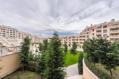 a view of a large apartment complex with trees and buildings at Stoyanov South Bay - Varna in Varna City