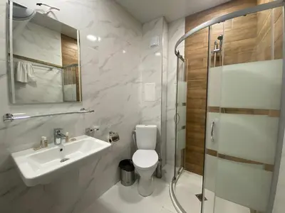 a bathroom with a sink and a toilet and a shower at The Green Paradise Apartments in Primorsko