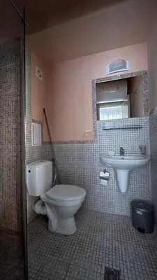a bathroom with a toilet and a sink at RAINBOW 3-103 Cozy Studio Sunny Beach in Sunny Beach