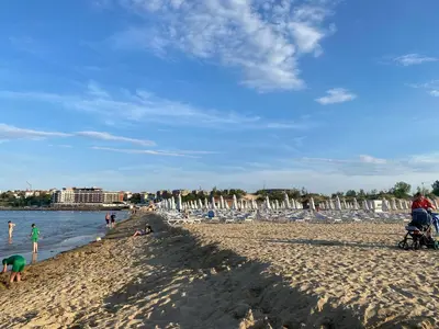 a group of people on a sandy beach at RAINBOW 3-103 Cozy Studio Sunny Beach in Sunny Beach